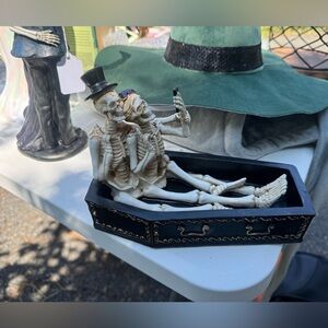 skeleton selfie in coffin halloween decor